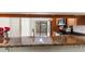 Granite countertops, stainless steel appliances, and light wood cabinets at 4573 Kingsmere # 27, Sarasota, FL 34235