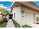 Condo exterior showcasing walkway to front door and garage at 4573 Kingsmere # 27, Sarasota, FL 34235