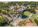 Aerial view of golf course, clubhouse, and parking at 4573 Kingsmere # 27, Sarasota, FL 34235