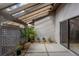 Private patio with pergola, lattice fence, and potted plants at 4573 Kingsmere # 27, Sarasota, FL 34235