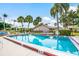 Community pool with plenty of lounge chairs at 4573 Kingsmere # 27, Sarasota, FL 34235