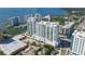 Aerial view showcasing modern high-rise building and surroundings at 301 Quay Commons # 1209, Sarasota, FL 34236
