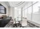 Modern meeting room with large glass windows and table at 301 Quay Commons # 1209, Sarasota, FL 34236
