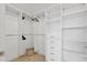 Large walk-in closet with ample shelving and hanging space at 301 Quay Commons # 1209, Sarasota, FL 34236