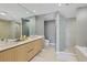Spa-like bathroom with double vanity and large soaking tub at 301 Quay Commons # 1209, Sarasota, FL 34236