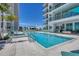 Expansive pool and spa with surrounding seating at 301 Quay Commons # 1209, Sarasota, FL 34236