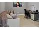 Bright home office featuring a comfortable couch and a modern desk at 301 Quay Commons # 1209, Sarasota, FL 34236