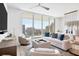 Bright living room with city views and comfortable seating at 301 Quay Commons # 1209, Sarasota, FL 34236