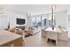 Open concept living and dining area with city views at 301 Quay Commons # 1209, Sarasota, FL 34236