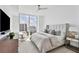 Main bedroom with large window, city view, and plush bedding at 301 Quay Commons # 1209, Sarasota, FL 34236