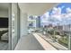 Expansive balcony with glass railings and stunning city views at 301 Quay Commons # 1209, Sarasota, FL 34236