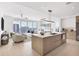 Open kitchen with island, modern appliances, and city views at 301 Quay Commons # 1209, Sarasota, FL 34236
