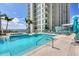 Inviting swimming pool with ample seating at 301 Quay Commons # 1209, Sarasota, FL 34236