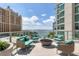 Cozy fire pit lounge area with water views at 301 Quay Commons # 1209, Sarasota, FL 34236