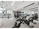 Modern gym with cardio and strength training equipment at 301 Quay Commons # 1209, Sarasota, FL 34236