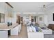 Spacious living area with modern furniture and city views at 301 Quay Commons # 1209, Sarasota, FL 34236