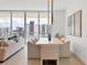 Modern dining area with city views and stylish decor at 301 Quay Commons # 1209, Sarasota, FL 34236