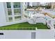 Artificial turf lawn with a bench at 301 Quay Commons # 1209, Sarasota, FL 34236