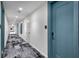 Building hallway with modern flooring and doors at 301 Quay Commons # 1209, Sarasota, FL 34236