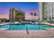 Resort-style pool with city views and sunset backdrop at 301 Quay Commons # 1209, Sarasota, FL 34236
