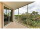 Private screened balcony with sliding glass doors and nature views at 2625 Terra Ceia Bay Blvd # 205, Palmetto, FL 34221
