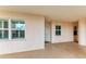 Exterior condo entrance with light colored walls and green shutters at 2625 Terra Ceia Bay Blvd # 205, Palmetto, FL 34221