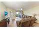 Spacious living room with wood floors and access to balcony at 2625 Terra Ceia Bay Blvd # 205, Palmetto, FL 34221