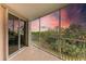Screened balcony overlooking lush landscape and sunset at 2625 Terra Ceia Bay Blvd # 205, Palmetto, FL 34221