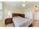Bright bedroom with double bed, wood furniture, and wood-look floors at 2625 Terra Ceia Bay Blvd # 205, Palmetto, FL 34221
