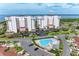 Aerial view of condo community with pool and water views at 2625 Terra Ceia Bay Blvd # 205, Palmetto, FL 34221