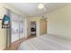 Bedroom with sliding doors to lanai and a view of the living room at 2625 Terra Ceia Bay Blvd # 205, Palmetto, FL 34221