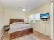 Bright bedroom with wood floors, large bed, and window shutters at 2625 Terra Ceia Bay Blvd # 205, Palmetto, FL 34221