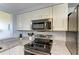 Kitchen with stainless steel appliances and granite countertops at 2625 Terra Ceia Bay Blvd # 205, Palmetto, FL 34221