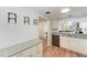 White shaker cabinets, granite countertops, and stainless steel appliances at 2625 Terra Ceia Bay Blvd # 205, Palmetto, FL 34221