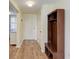 Condo entryway with wood-look floors and built-in bench at 2625 Terra Ceia Bay Blvd # 205, Palmetto, FL 34221