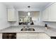 Kitchen with granite countertops and view into living area at 2625 Terra Ceia Bay Blvd # 205, Palmetto, FL 34221