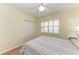 Bedroom with wood floors, double door closet and window shutters at 2625 Terra Ceia Bay Blvd # 205, Palmetto, FL 34221