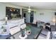 Spacious screened patio, dining table, bar area, ceiling fan at 22119 Laramore Ave, Port Charlotte, FL 33952