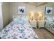 Main bedroom with mirrored closet and ocean-themed bedding at 22119 Laramore Ave, Port Charlotte, FL 33952