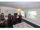 Bright home office features a desk, computer, and ample natural light at 22119 Laramore Ave, Port Charlotte, FL 33952