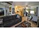 Open concept living area with a comfortable sofa and adjacent dining area at 22119 Laramore Ave, Port Charlotte, FL 33952