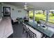 Large screened porch with dining and seating areas at 22119 Laramore Ave, Port Charlotte, FL 33952