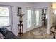 Bright entryway with tile floor, glass doors and mirror at 22119 Laramore Ave, Port Charlotte, FL 33952