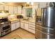 Modern kitchen with stainless steel appliances and light wood cabinets at 22119 Laramore Ave, Port Charlotte, FL 33952