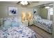 Main bedroom with mirrored closet and ocean-themed bedding at 22119 Laramore Ave, Port Charlotte, FL 33952