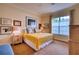 Bright bedroom with a queen-size bed and plenty of natural light at 7204 Saint Georges Way, University Park, FL 34201