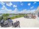 Spacious backyard with patio furniture and a lake view at 5120 Vecchio Ct, Bradenton, FL 34211