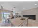 Kitchen island with granite countertop and sink, open to living area at 5120 Vecchio Ct, Bradenton, FL 34211