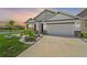 Two story home with a landscaped front yard at 5120 Vecchio Ct, Bradenton, FL 34211