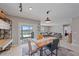 Dining area with wooden table and access to the backyard at 5120 Vecchio Ct, Bradenton, FL 34211